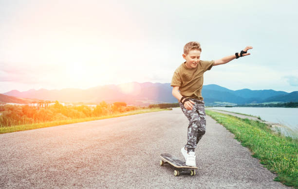 Boy learn to skate on skateboard