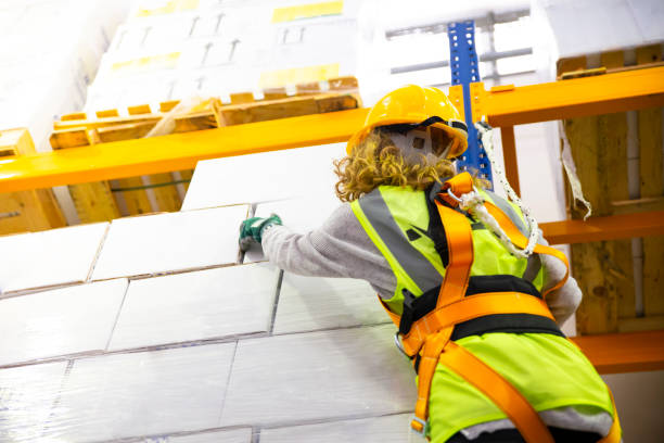 istock Women with safety harness in warehouse 1139349510