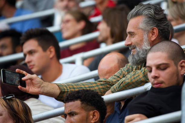 istock Senior man taking a selfie at a footbal match 1139349607