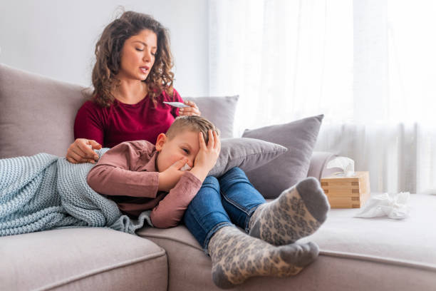 istock Mother measuring temperature of her ill kid. 1139351346