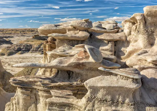 Layers of erosion sculpted hoodoos shaped like starships in the BIsit/De-Na-Zin WIlderness in New Mexico.