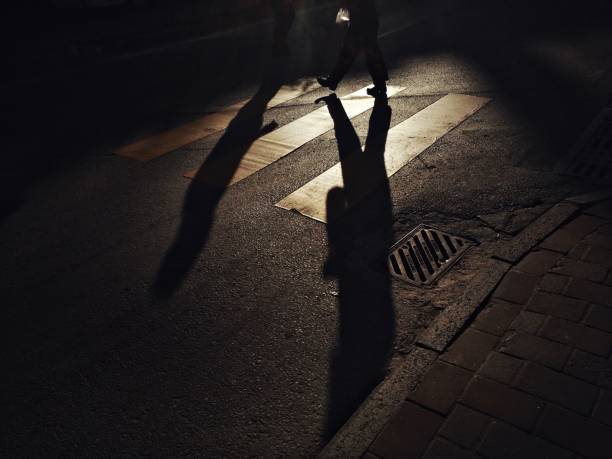 istock Shadows of the people walking on crosswalk 1139353425