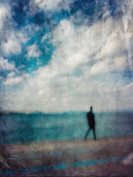 istock Defocused view of a man walking in the seaside 1139353935