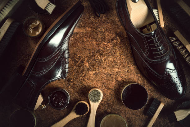 shoes care product concept still life, vintage style composition with shoe care products on a vintage wood and rustic background, vintage style shoe polish stock pictures, royalty-free photos & images