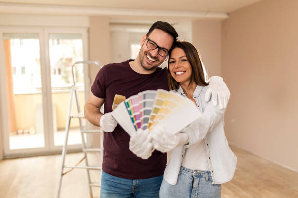 istock Smiling couple preparing for painting 1139354344