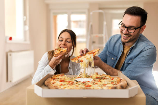 istock Couple eating tasty pizza 1139354524