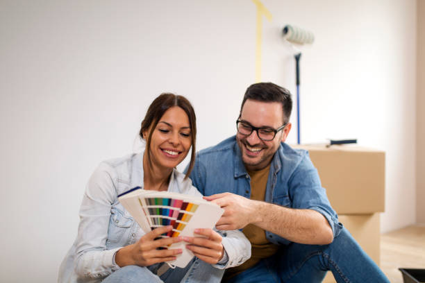 istock Couple choosing wall color 1139354589