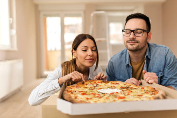 istock Couple eating tasty pizza 1139355123