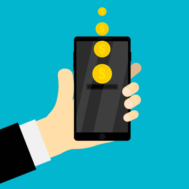 istock Hand holding mobile with money money on screen golden coins holding device with dollar bills EPS 10 1139355267