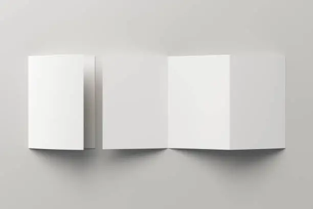 Blank trifold of three of A5/A4 pages brochure booklet on white background with clipping path around brochure. Folded and unfolded. 3D illustration