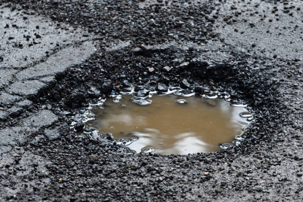 istock Pothole in an Asphalt Road Close Up 1139366755
