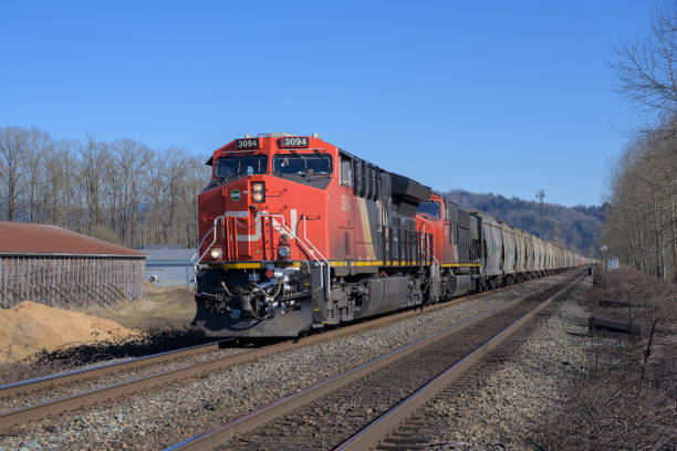 CN Potash Train in Abbotsford, BC Abbotsford, British Columbia / Canada - March 3, 2019: Canadian National potash train rolling through Abbotsford, BC. abbotsford canada stock pictures, royalty-free photos & images