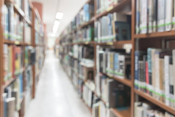 istock Blur school library or study room with book shelves for education background 1139369741