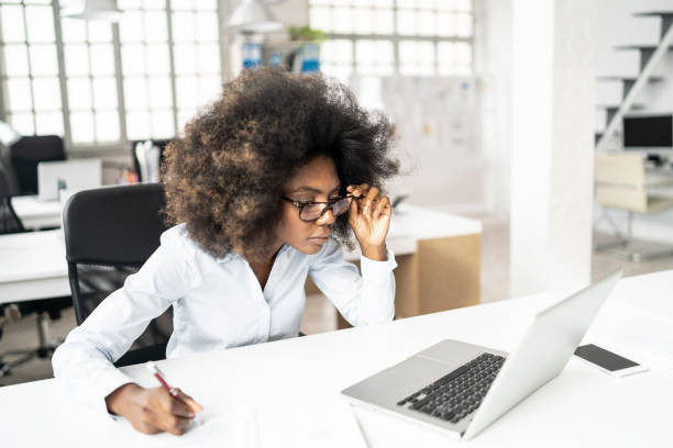 istock African woman looking at laptop 1139370007