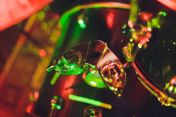 Photo of Drum kit on stage in the spotlight color.