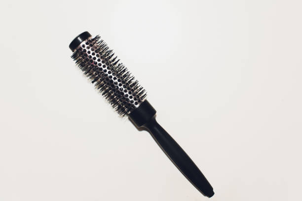 istock round hairbrush with a handle on a white background. 1139370057