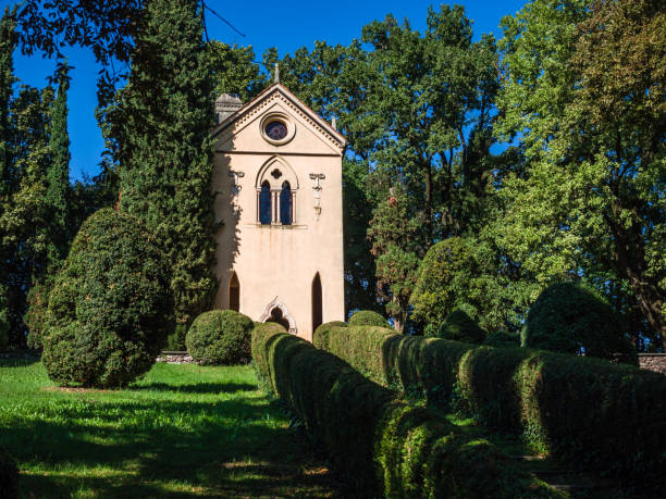 istock Small church among the trees in Italy. 1139370482
