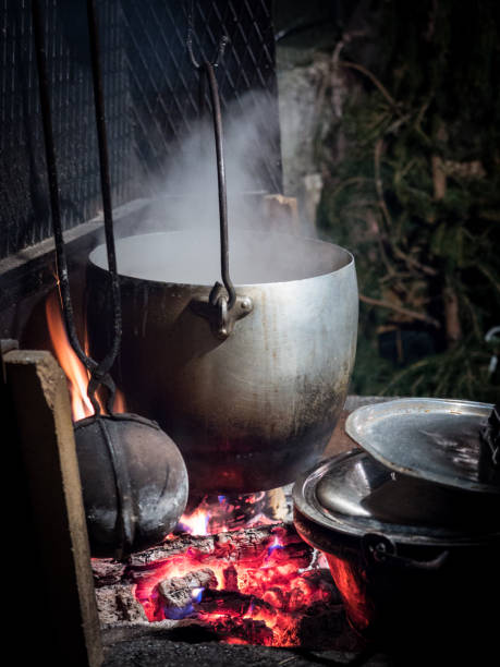 istock Pot hanging from the fireplace above the wood fire. 1139370486