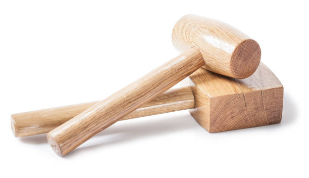 istock two wooden mallets woodworkers tools isolated on white bavkground 1139373355