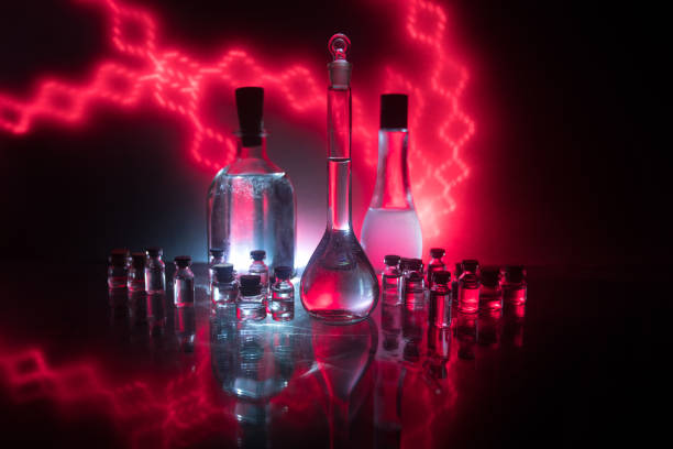 Pharmacy and chemistry theme. Test glass flask with solution in research laboratory. Science and medical background. Laboratory test tubes on dark toned background , science research equipment concept