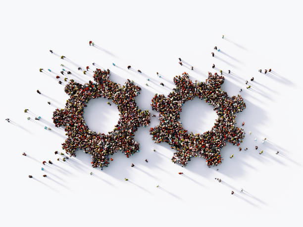 istock Human Crowd Forming Two Gear Symbols 1139377485