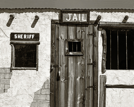 Jail and Sheriff's Office in an Old West Ghost Town in black and white