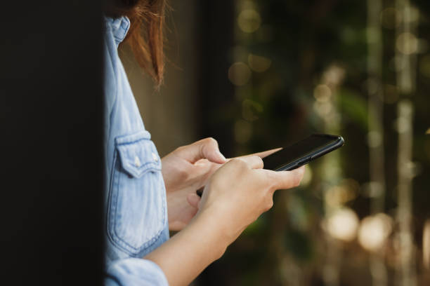 istock woman using smartphone in free time. 1139383717