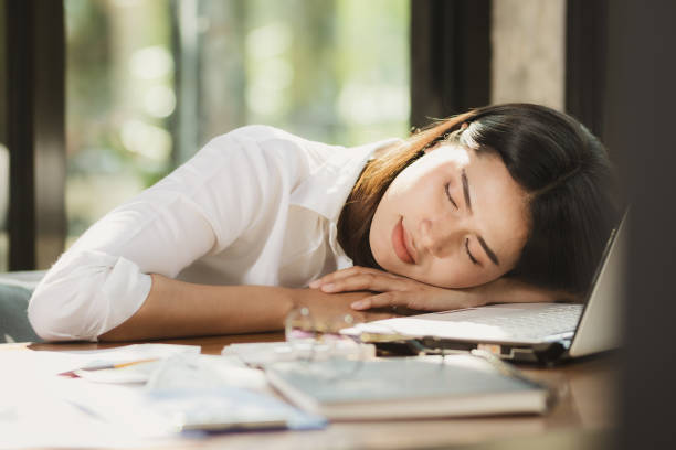 istock woman take a rest in office,home. 1139384345