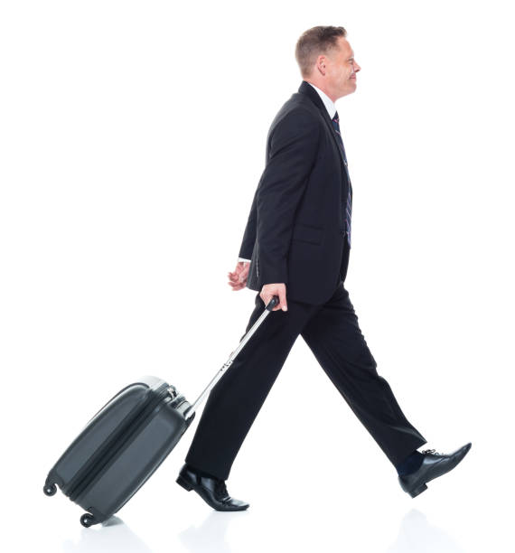 istock Businessman is walking while holding suitcase 1139387211