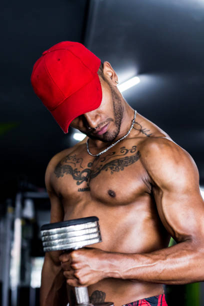 istock Strong man with a strong body holding a weight 1139388117