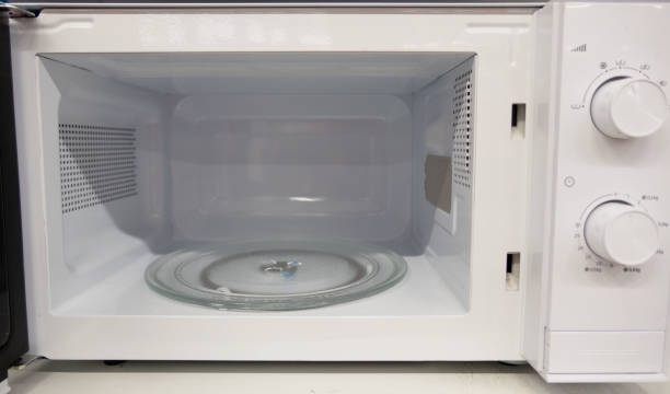 istock open empty new microwave , Inside of the microwave oven 1139394345