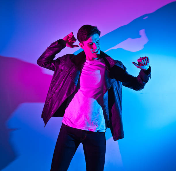 istock Handsome young man in colorful environment 1139395402