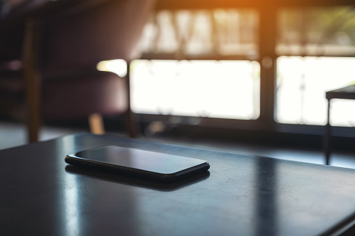 A single black mobile phone on the table