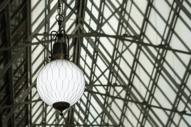 istock Retro lamp on a grunge background, flea market ceiling 1139402695