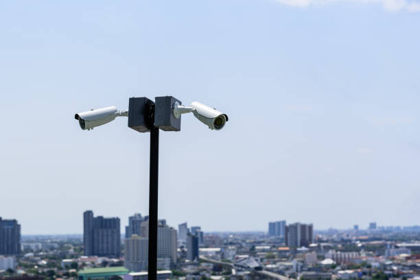 istock CCTV surveillance security camera on a black pole with blue sky background 1139409205