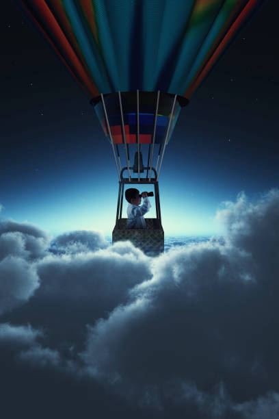 istock Man looking through binoculars above clouds during night . Flying with a hot air balloon 1139414901