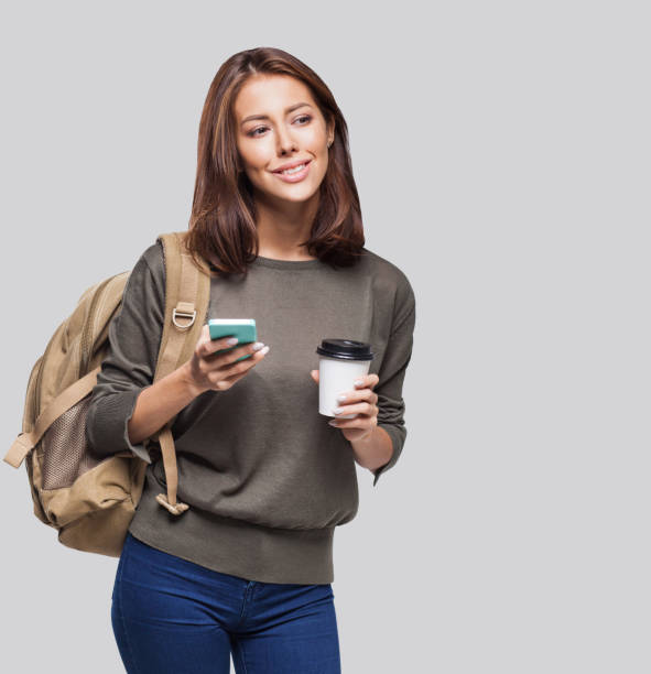 istock Happy young student girl using smart phone 1139422935