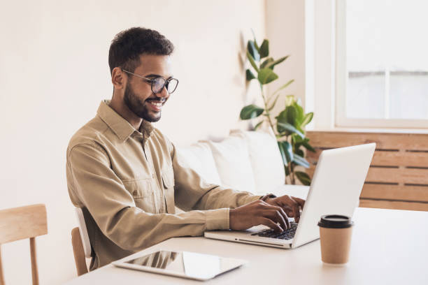 Men working at home. Freelancer businessman using laptop