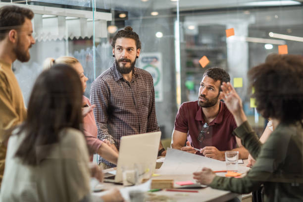istock Creative people communicating while having a meeting at casual office. 1139426946
