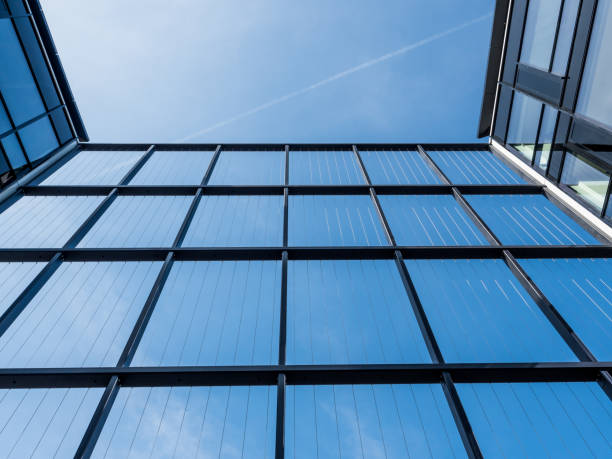 istock Detail of linear modern architecture, white with blue sky 1139428209
