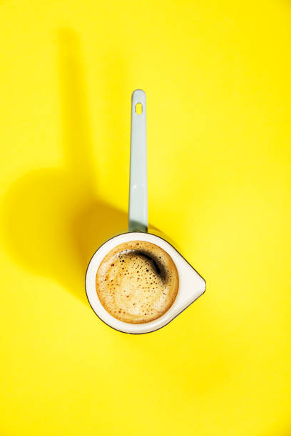 istock Coffee on yellow background, flat lay, top view 1139428376