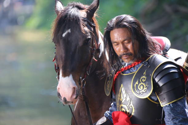 istock Man In Warrior Costume With Horse 1139432705
