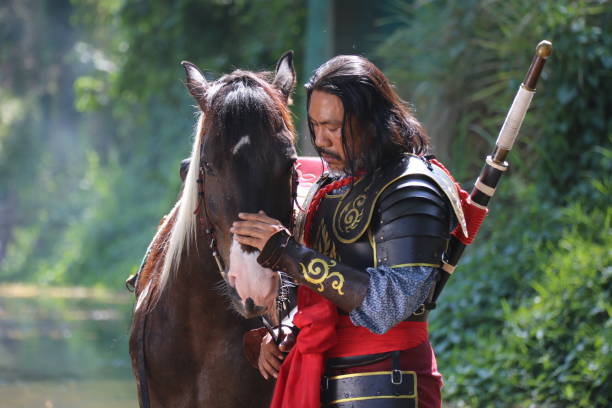 istock Man In Warrior Costume With Horse 1139432710