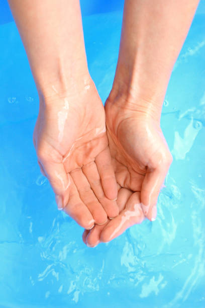 istock Washing hands in water, macro, blue background 1139436317