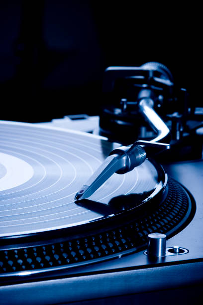 istock Record player playing LP in dark room, macro picture 1139436327