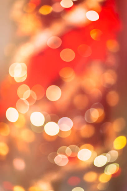 istock Blurred festive background made with Christmas tree lights and decorations. New year backdrop. Perfect design for warm family holidays projects. 1139436567