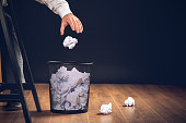 Man Throwing Away Papers into Trash Bin, Inspiration, Creativity and Idea Concept For Business