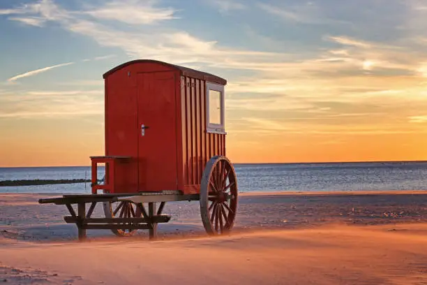 red wooden trailer on the beach of german island Borkum