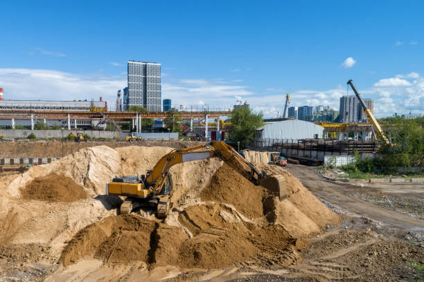istock Tracked excavator overloads the sand from the embankment 1139441449