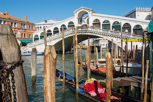 Venice, Italy - February 26, 2007: View of the landmark Ponte di Rialto bridge over the Grand Canal in Venice, Italy.